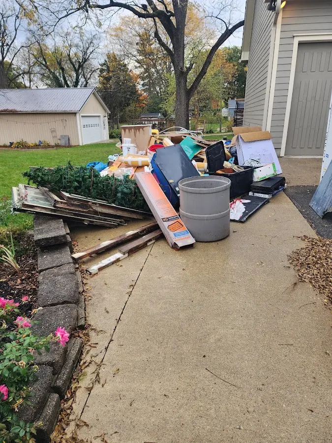 Dumpster being loaded with debris for 3 Yard Dumpster Rental in Haltom City